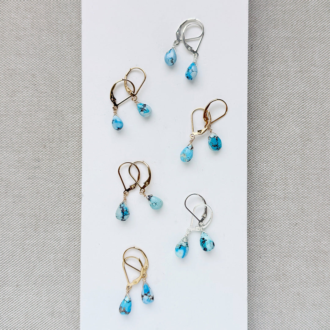Tear drop shaped Golden Hills turquoise earrings in gold and silver