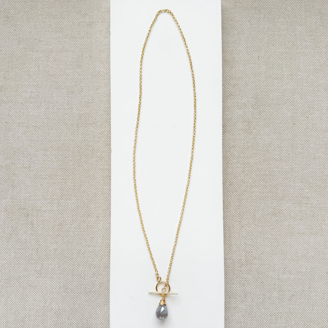 Gold necklace with toggle and moonstone drop