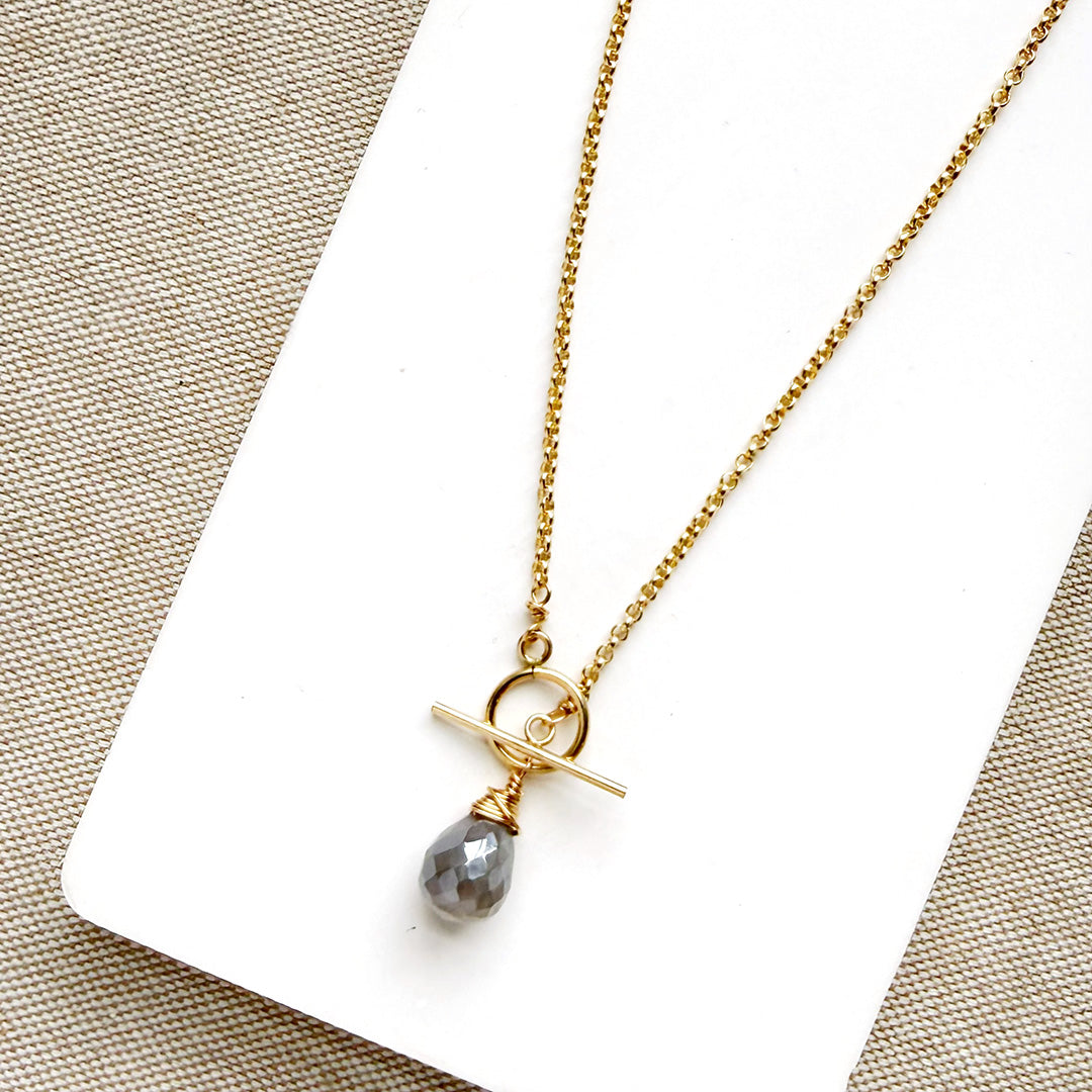 Gold necklace with toggle and moonstone drop