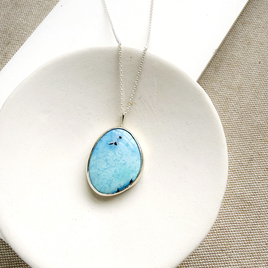 Golden Hills Turquoise pendant necklace in a white dish