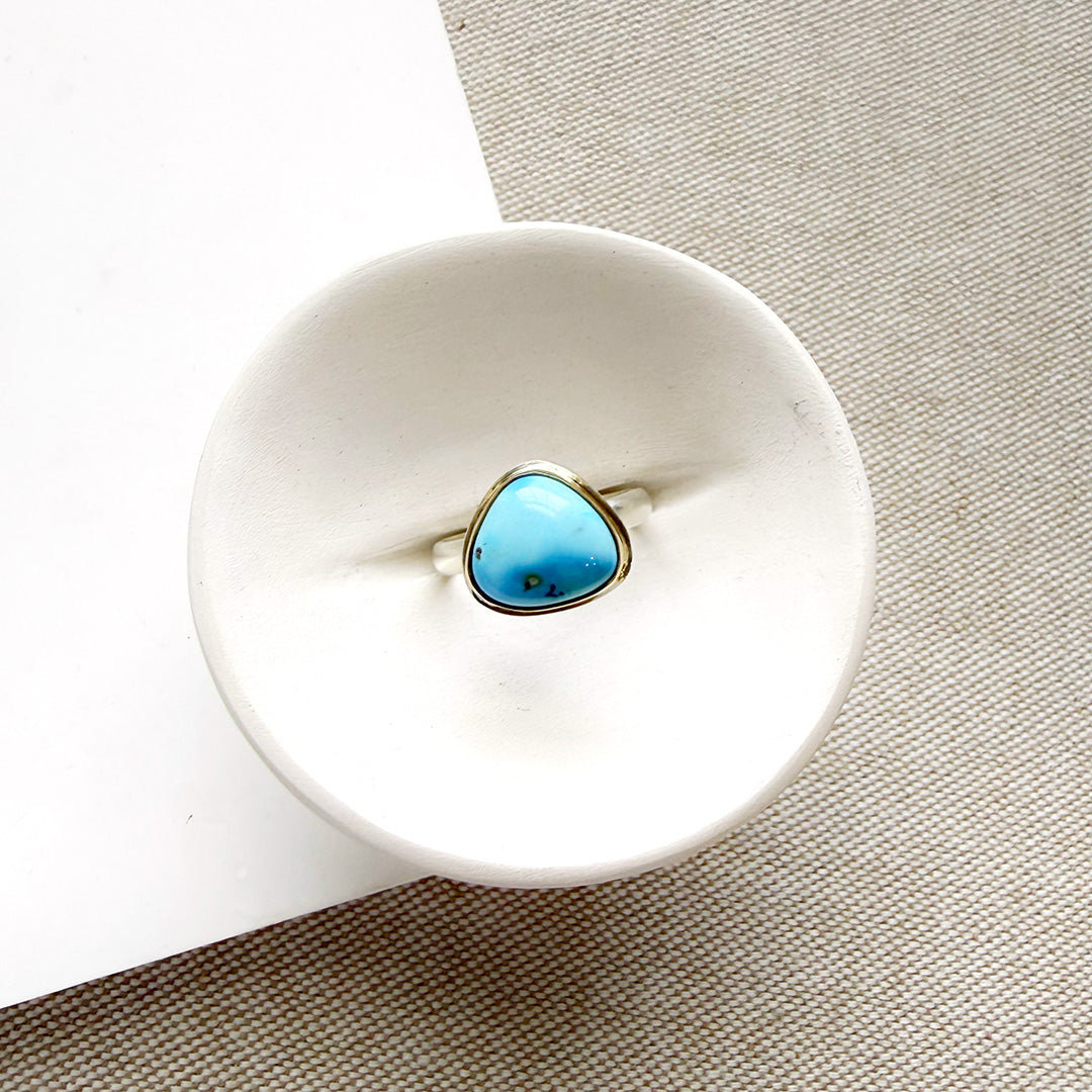 One of a kind Golden Hills turquoise mixed metal ring on a white background