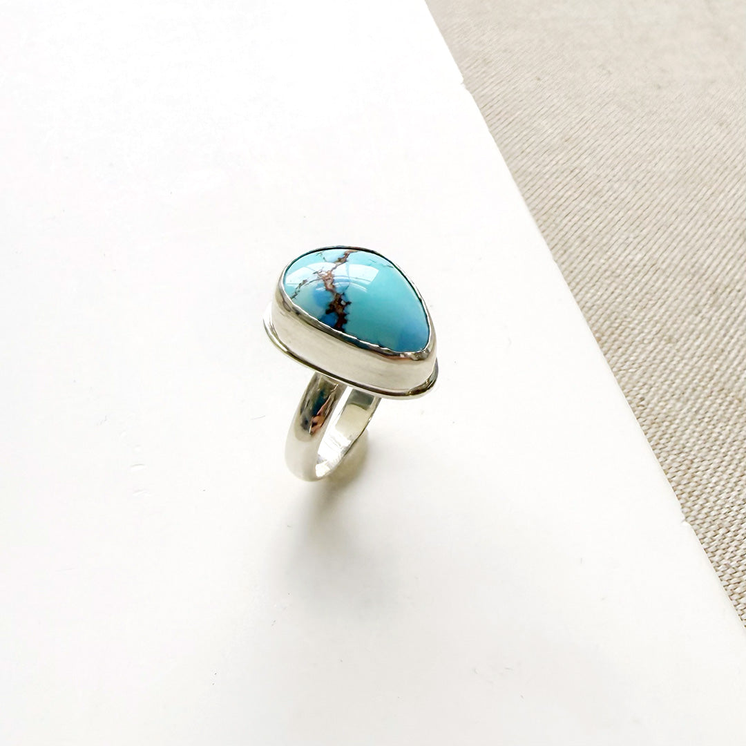 One of a kind Golden Hills Turquoise silver ring on a white background