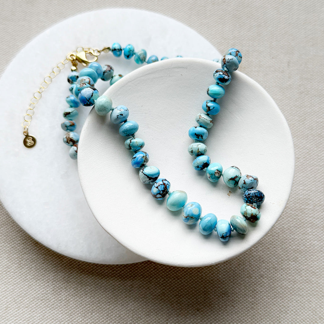 Golden Hills Turquoise knotted necklace in a white dish