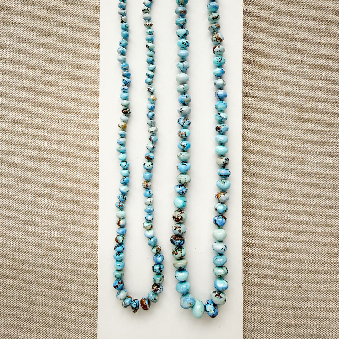 Size comparison of two knotted Golden Hills turquoise necklaces
