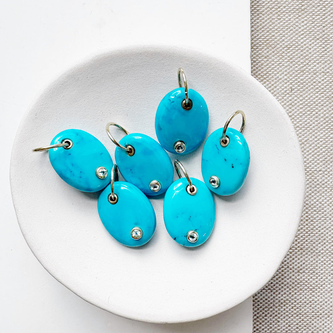 Oval blue howlite charm with inset quartz stone