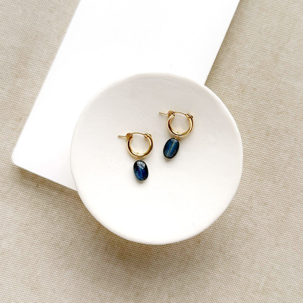 Gold hoop earrings with blue kyanite gemstone drop