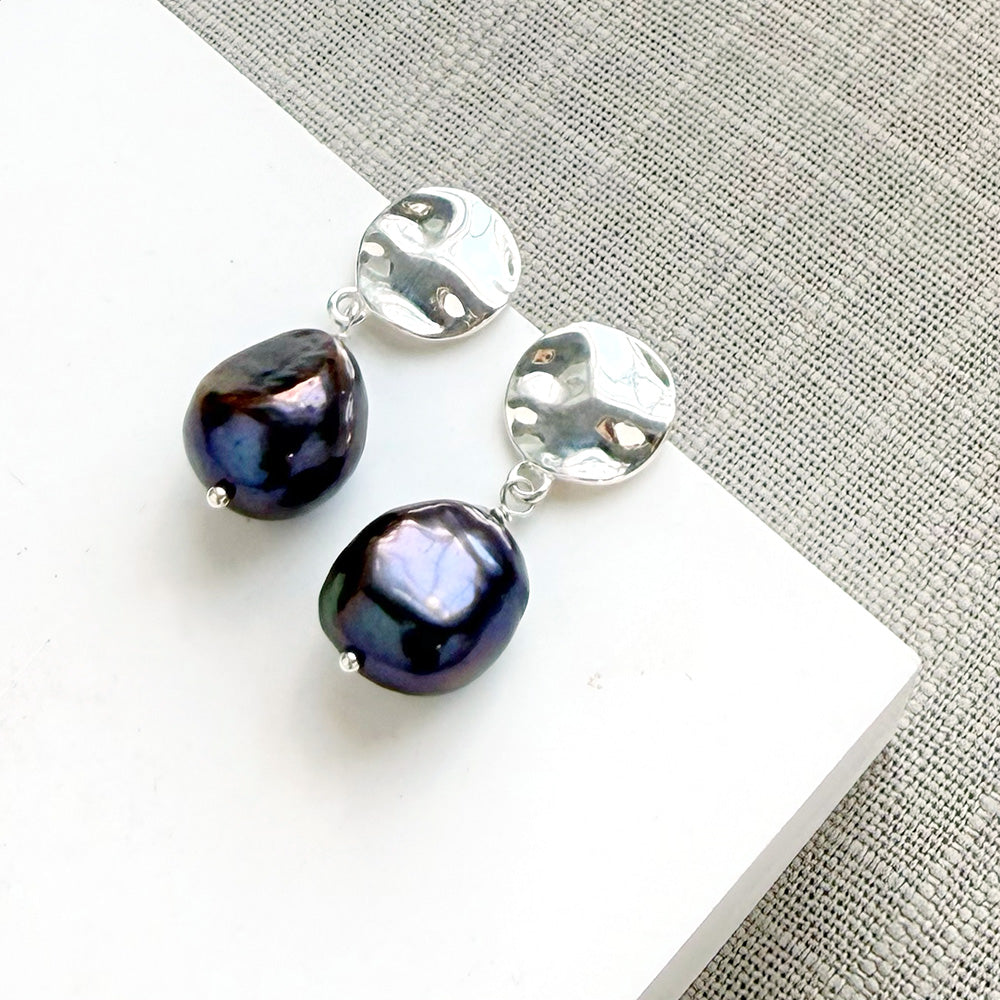 Peacock pearl earrings with a silver disc
