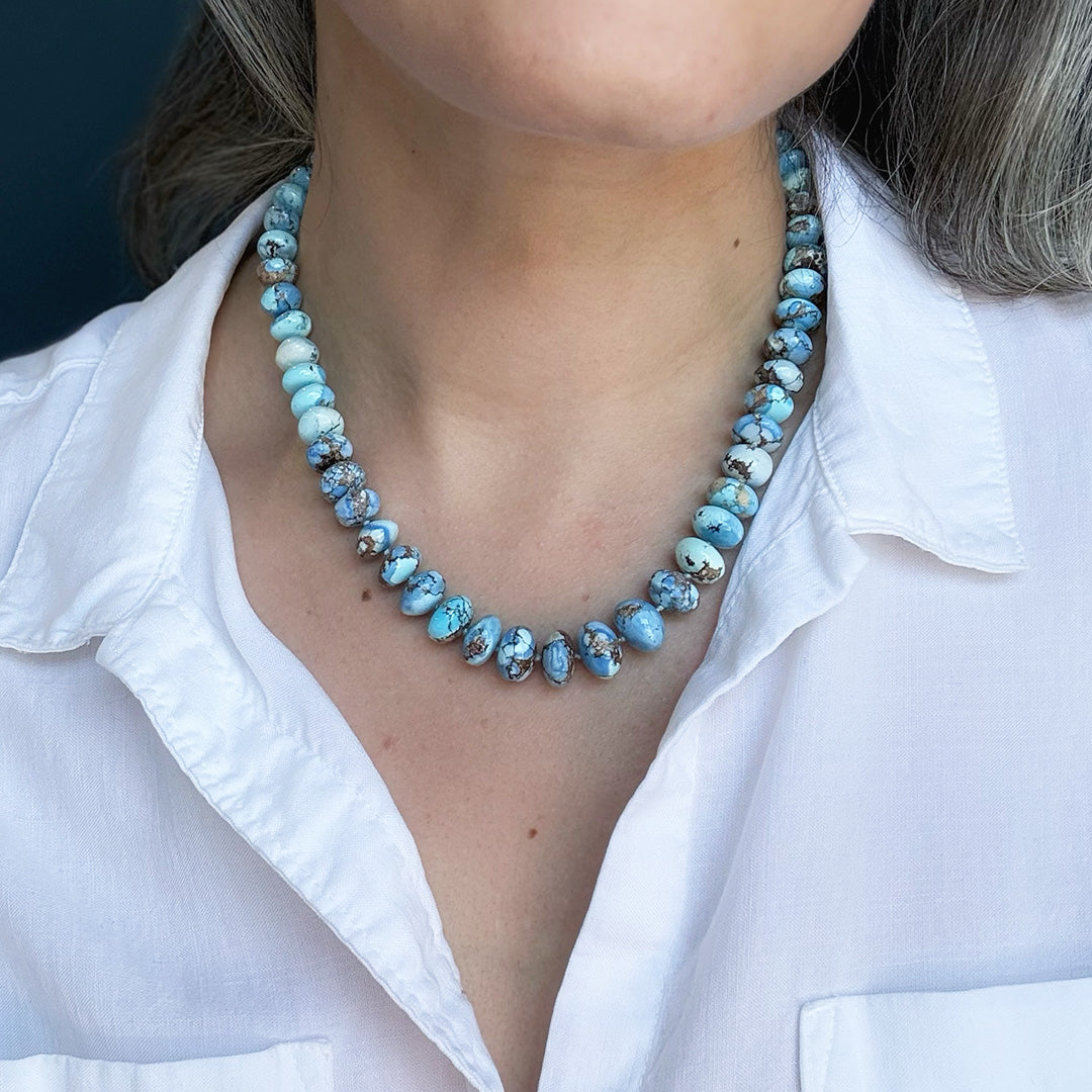 Golden Hills turquoise beaded necklace worn by a person with a white shirt