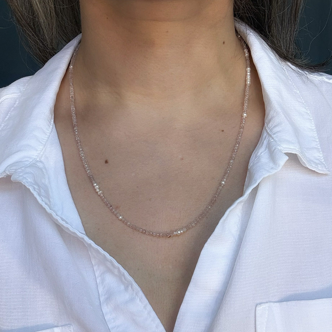 Option 1 worn as a Necklace by a person with a white shirt