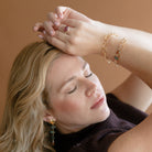 Woman wearing pink tourmaline mixed metal ring