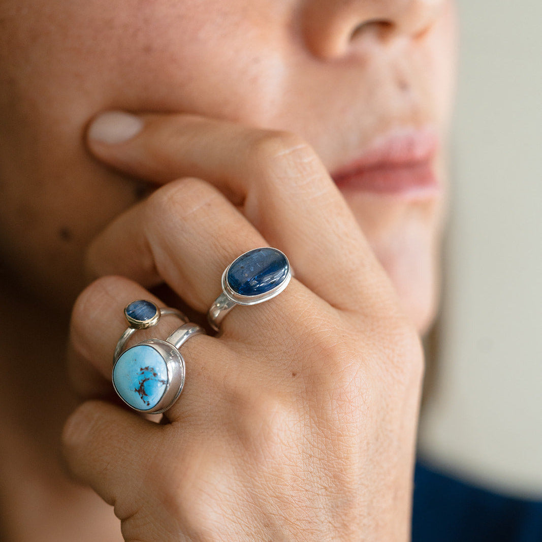 Woman wearing one of a kind gemstones rings