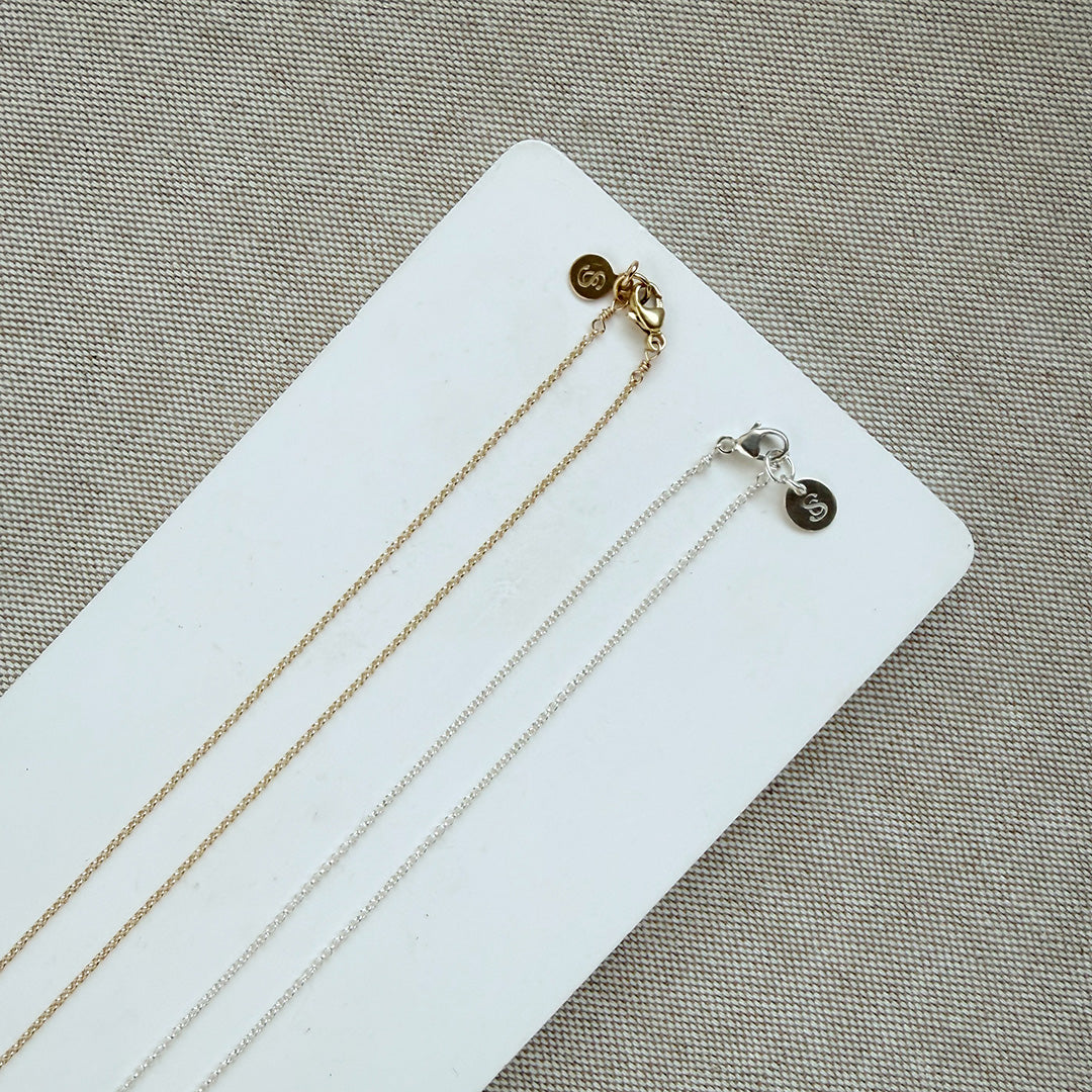 Clasp detail of gold and silver necklaces