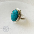 Arizona turquoise ring with one-of-kind icon on a white background