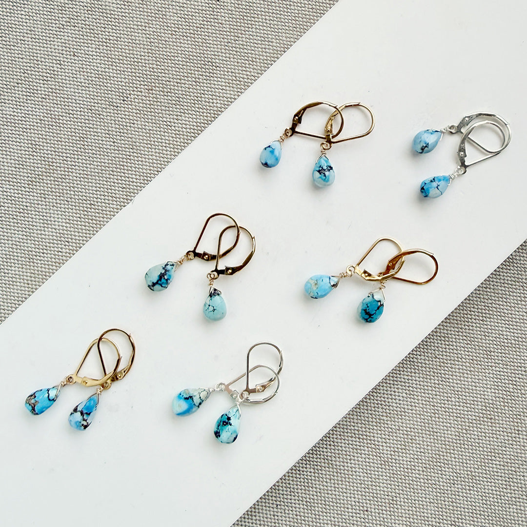 Tear drop shaped Golden Hills turquoise earrings in gold and silver