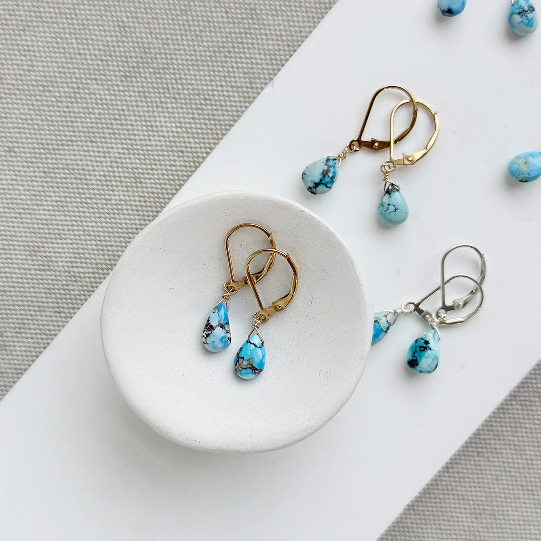 Tear drop shaped Golden Hills turquoise earrings in gold and silver
