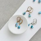 Tear drop shaped Golden Hills turquoise earrings in gold and silver