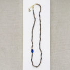 Smokey quartz knotted gemstone necklace on a white background