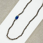 Smokey quartz knotted gemstone necklace on a white background