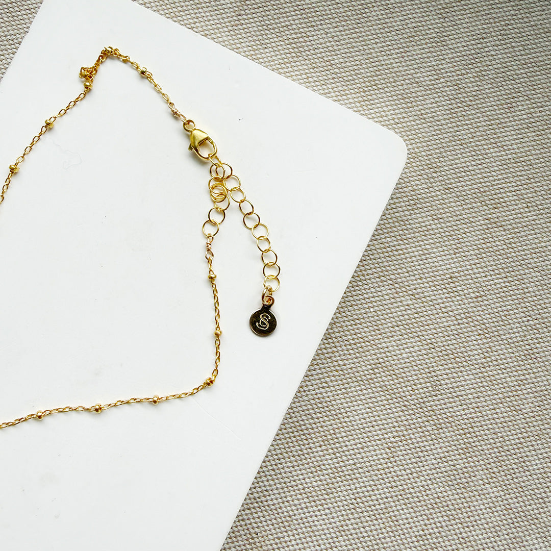 Clasp detail of gold chain necklace