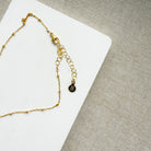 Clasp detail of gold chain necklace