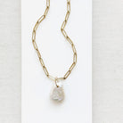 Keshi pearl charm with large gold ring on a gold paperclip chain