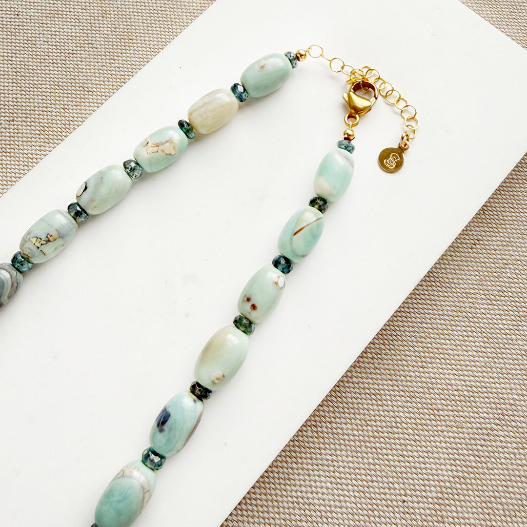 Necklace with agate beads on a white card