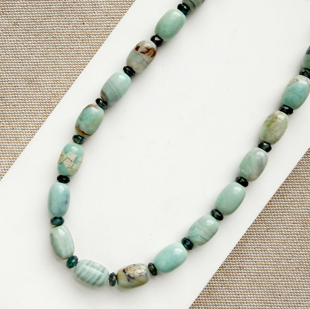 Necklace with agate beads on a white surface