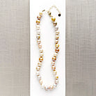 Champagne pearl knotted necklace in a white dish