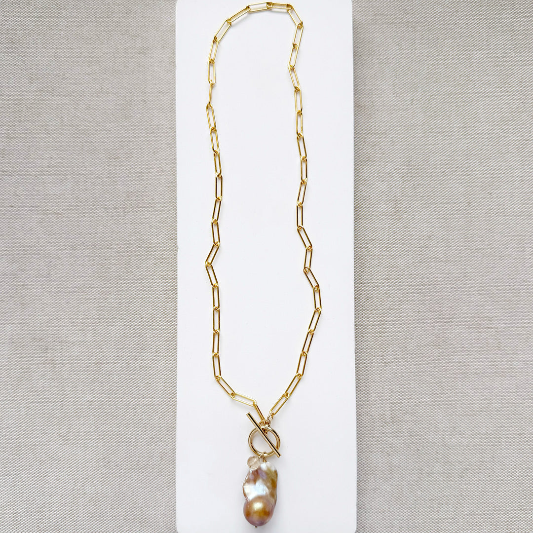 Gold necklace with large blush colored baroque pearl