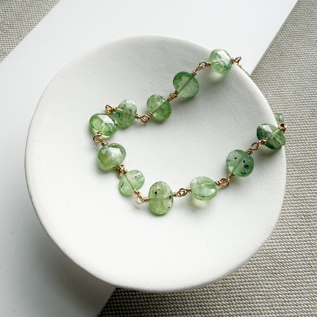 Green Kyanite bracelet on a white dish