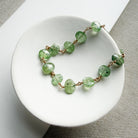 Green Kyanite bracelet on a white dish