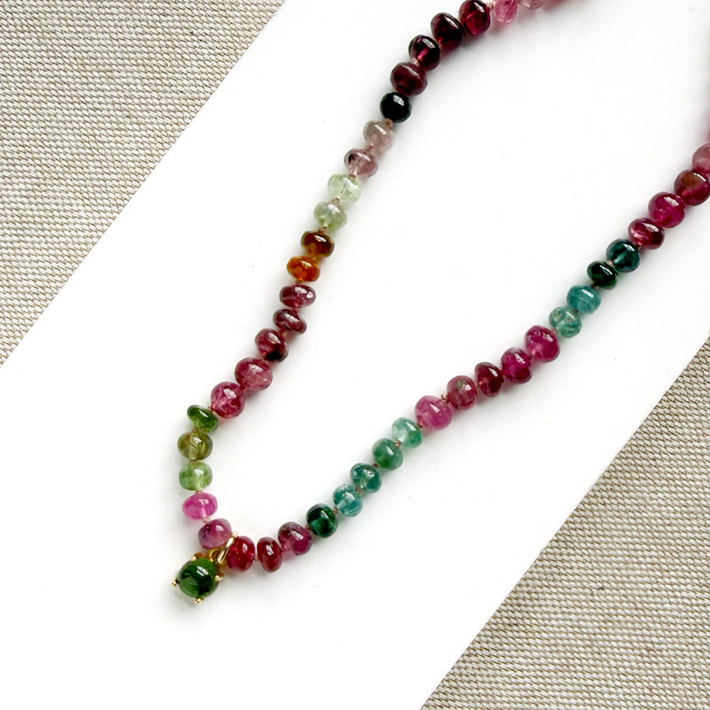 Necklace with smooth Watermelon Tourmaline in shades of pink, red, green, blue, and orange, featuring a small green tourmaline charm