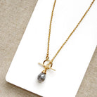 Gold necklace with toggle and moonstone drop
