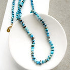 Golden Hills turquoise beaded necklace on a white dish with a neutral background