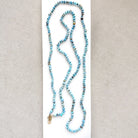 Golden Hills turquoise beaded necklace on a white dish with a neutral background