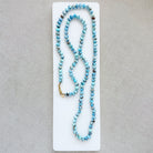 Golden Hills turquoise beaded necklace on a white dish with a neutral background