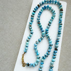 Golden Hills turquoise beaded necklace on a white dish with a neutral background