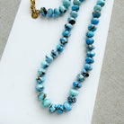 Golden Hills turquoise beaded necklace on a white dish with a neutral background