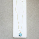 Golden Hills turquoise pendant necklace in solid gold on a white background 