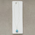 Golden Hills turquoise pendant necklace in sterling silver  on a white card.