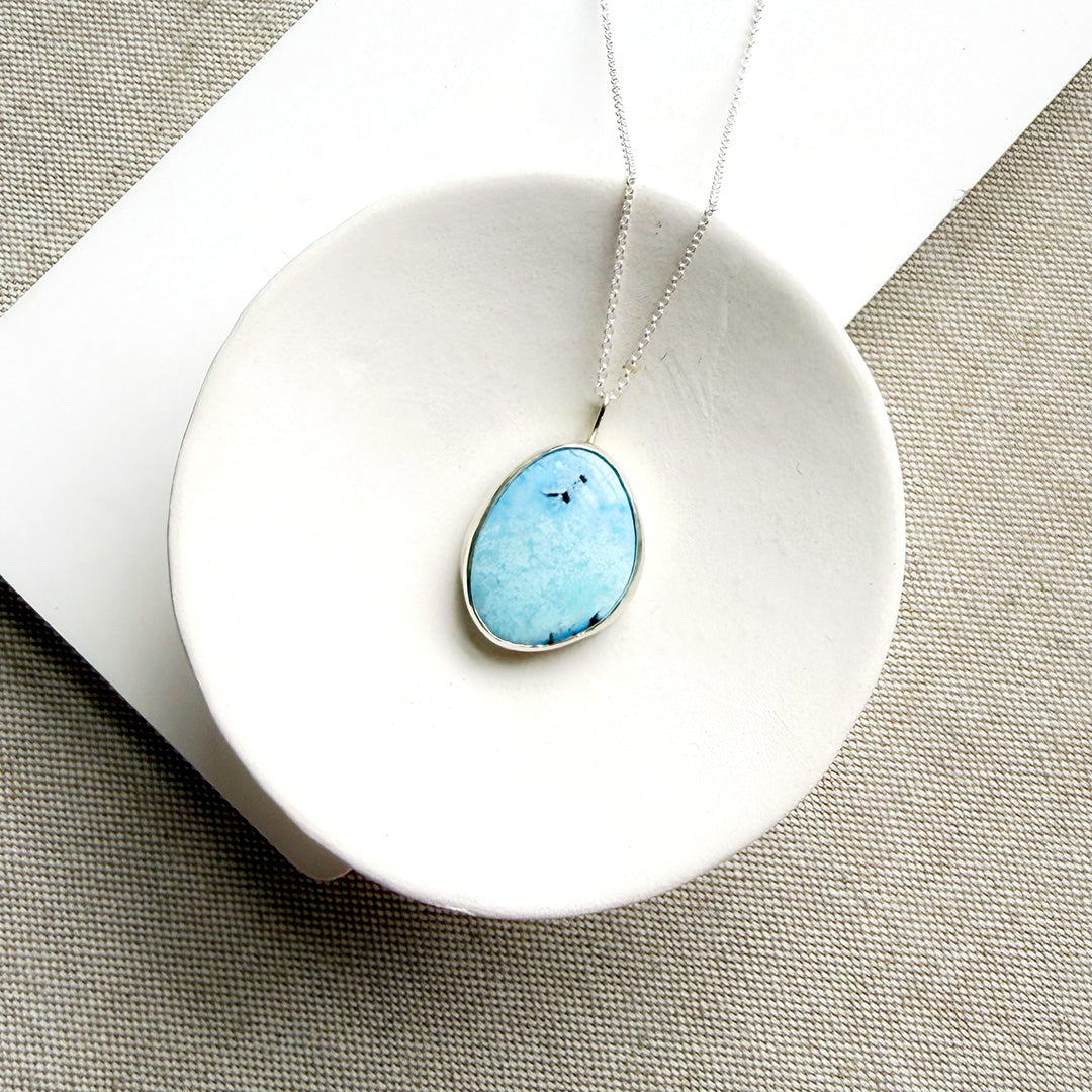 Golden Hills Turquoise pendant necklace in a white dish.