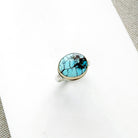 One of a kind Golden Hills turquoise mixed metal ring on a white background