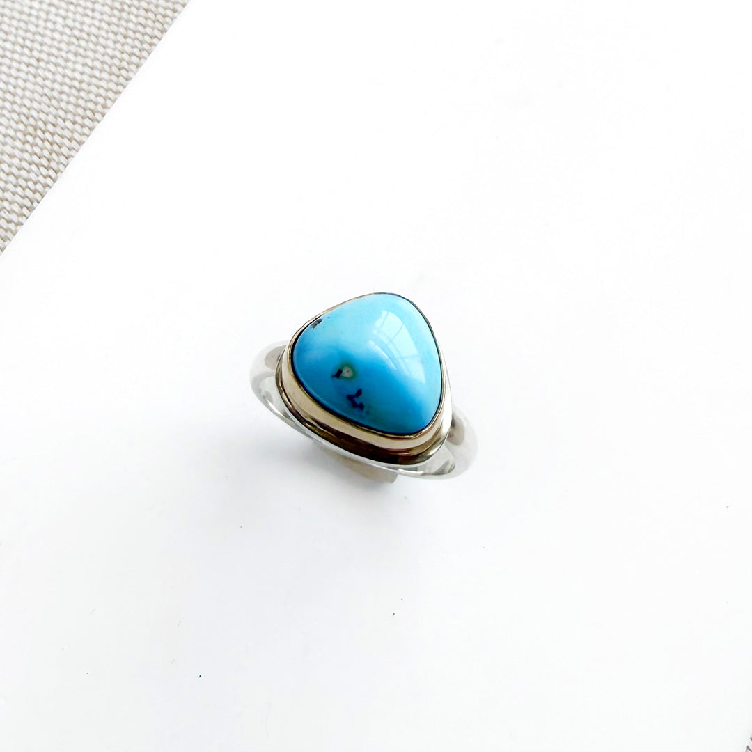 One of a kind Golden Hills turquoise mixed metal ring on a white background