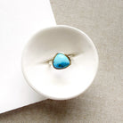 One of a kind Golden Hills turquoise mixed metal ring on a white background