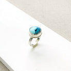 One of a kind Golden Hills Turquoise silver ring on a white background
