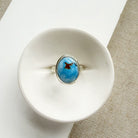 One of a kind Golden Hills Turquoise silver ring on a white background