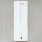 Silver gemstone pendant with carved scarab details