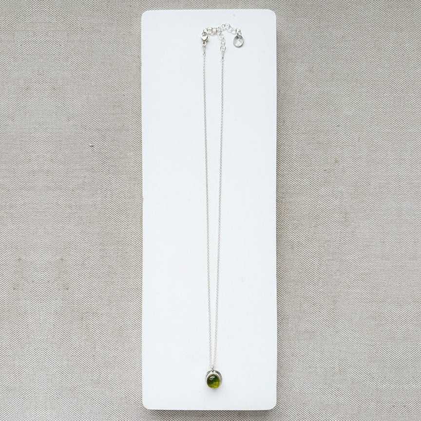 Silver gemstone pendant with carved scarab details