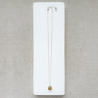 Silver gemstone pendant with carved scarab details
