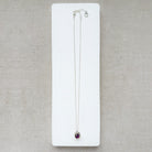 Silver gemstone pendant with carved scarab details